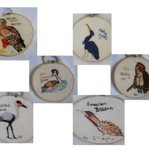 Embroidered birds framed in hoops